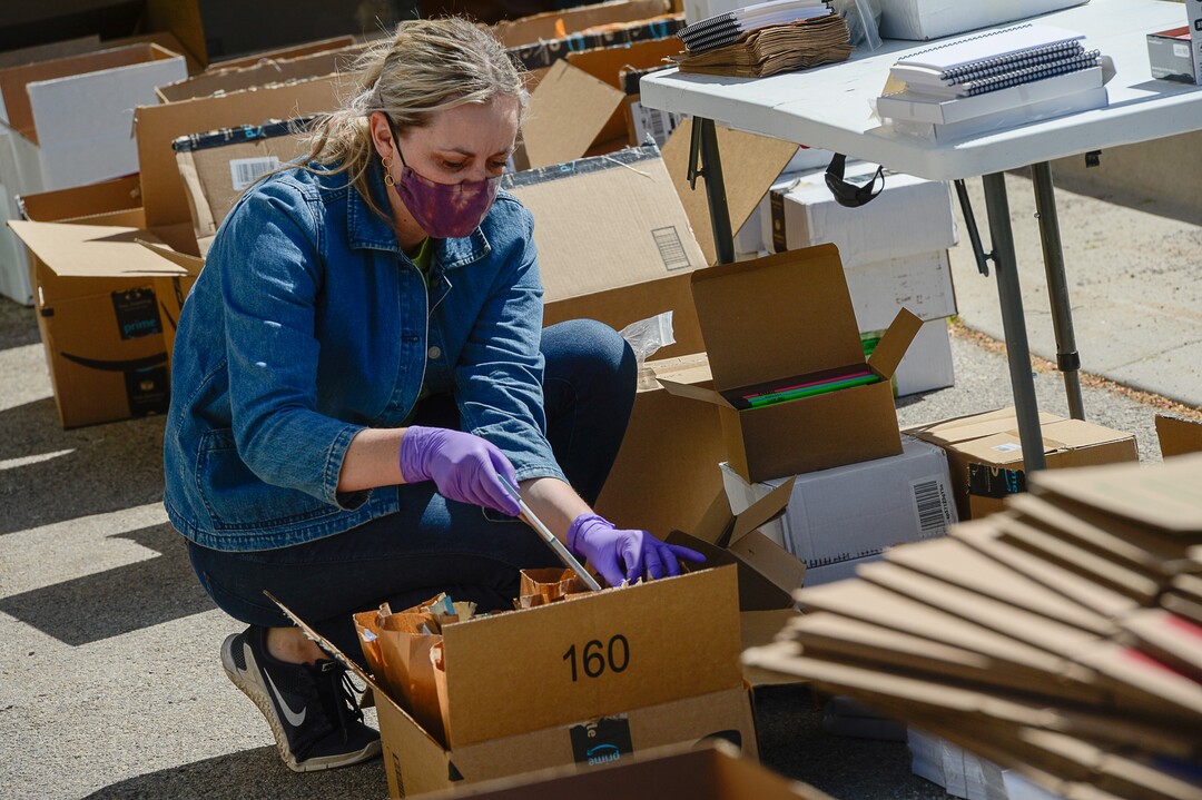 (Francisco Kjolseth  |  The Salt Lake Tribune) The UMFA learning engagement team member Ashley Farmer helps assemble "UMFA Art Kits," to provide art supplies to high school students to help them complete end-of-year course work. The volunteers filled 1,500 kits with colored pencils, postcards and art activities on Friday, May 4, 2020, to help kids in the Granite School District and Whitehorse High School in San Juan County, to finish school projects and get excited about home projects during the coronavirus pandemic.