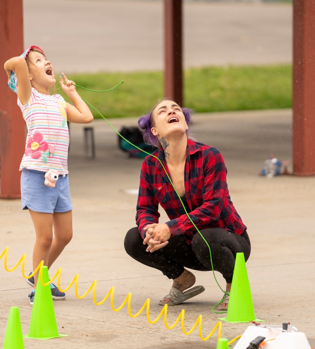 (Rick Egan | The Salt Lake Tribune) Talya Buhler and her mother Katlyn Buhler launch a hand-made rocket at the14th annual Craft Lake City DIY FEST, at the Fair Park, Aug. 13, 2022. 