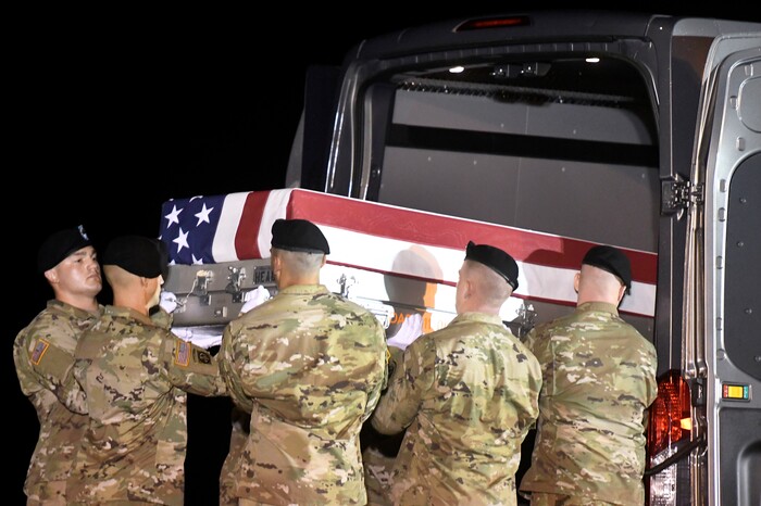 (Steve Ruark  |  AP Photo)  An Army carry team moves a transfer case containing the remains of Staff Sgt. Aaron R. Butler at Dover Air Force Base, Del., Friday, Aug. 18, 2017. According to the Department of Defense, Butler, of Monticello, Utah, died Aug. 16 in Nangarhar province, Afghanistan, of injuries sustained from an improvised explosive device while conducting combat operations.