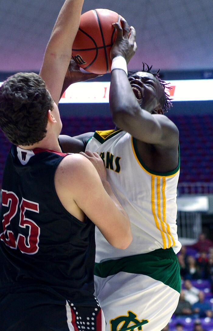 (Leah Hogsten  |  The Salt Lake Tribune) Kearns' Emmanuel Andrew (04) fights Weber's Kobe Furqueron (25) to get to the net. Weber defeated Kearns 60-52 in the 6A High School Boys' Basketball Tournament opening game at Weber State University’s Dee Events Center in Ogden, Tuesday, Feb. 27, 2018. 