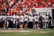 (Trent Nelson | The Salt Lake Tribune) Utah State players surround Utah State Aggies linebacker Harrison Taggart (0) as he's taken off the field as Utah hosts Utah State, NCAA football in Salt Lake City on Thursday, Sept. 17, 2026.