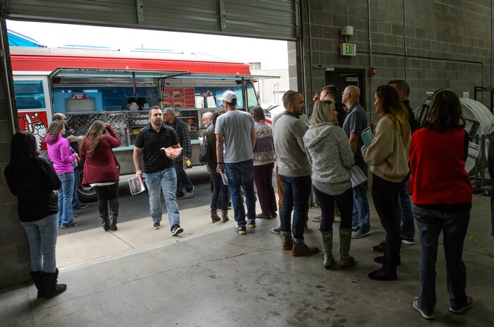 (Steve Griffin  |  The Salt Lake Tribune)  Access Development employees line up for a free food truck lunch on the company after attending an open enrollment benefits meeting at the Salt Lake City company Thursday November 16, 2017. 