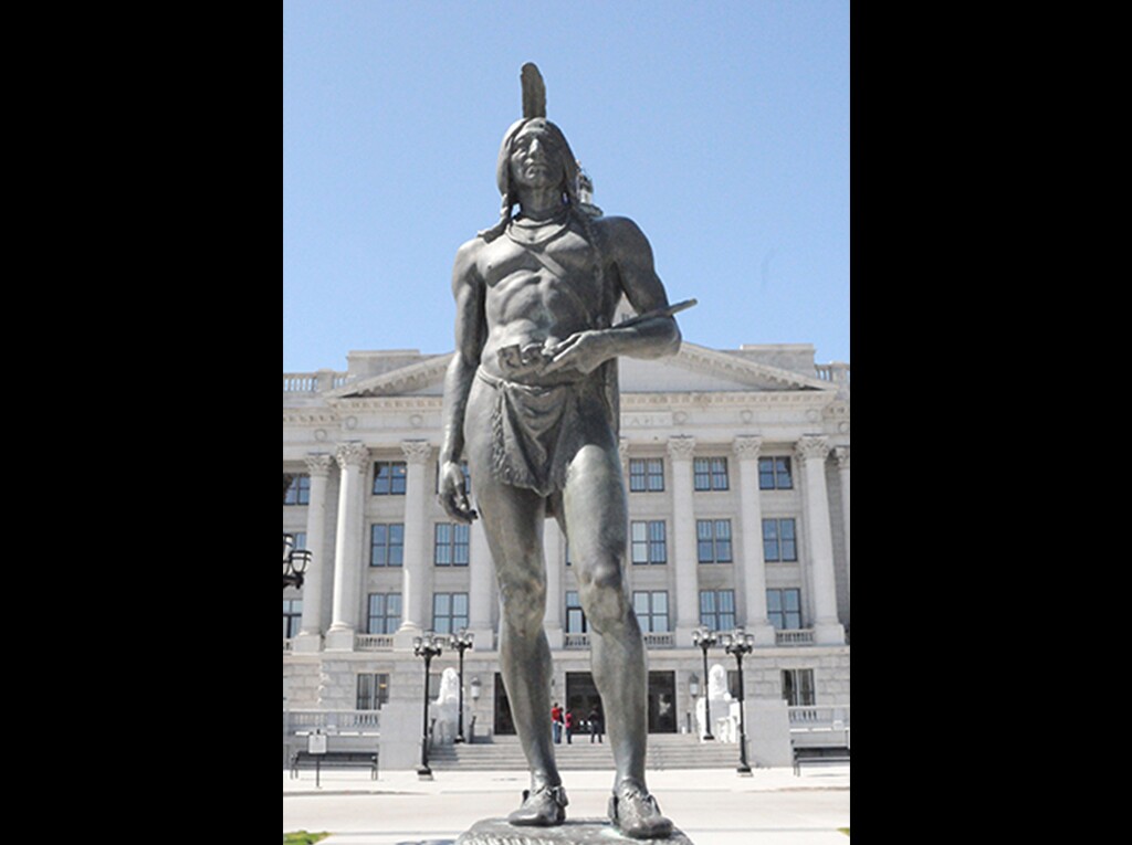 (Photo courtesy of the Utah State Capitol) A statue of Chief Massasoit by Utah artist Cyrus E. Dallin in front of the East doors of the Capitol. Massasoit was a Native American who greeted pilgrims at Plymouth, Mass.