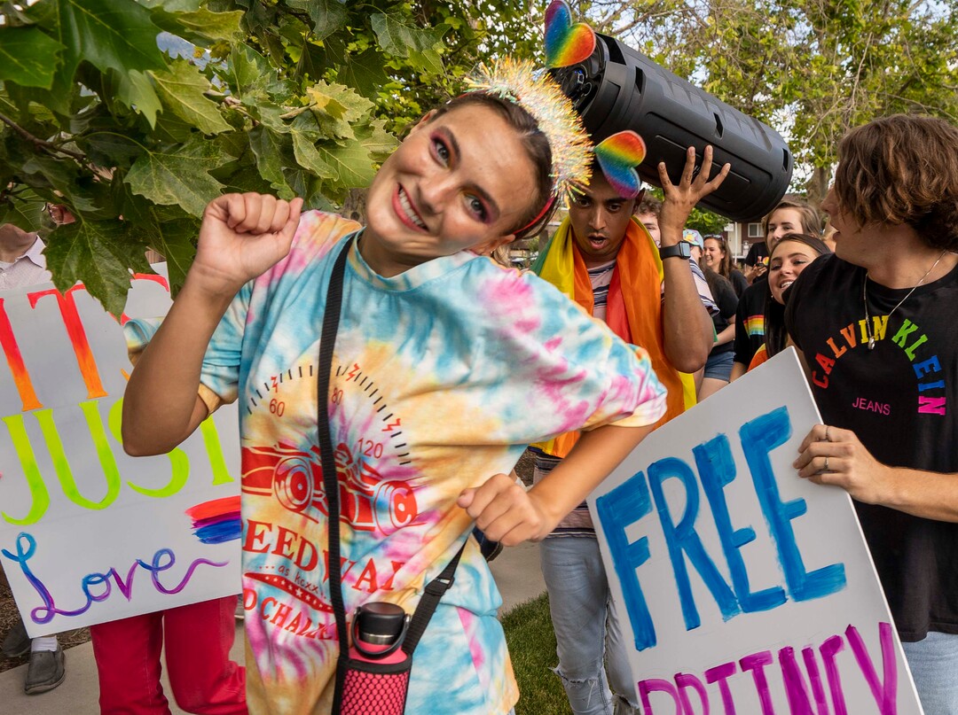 (Rick Egan | The Salt Lake Tribune) Deanna Moore dances to Lady Gaga, while she marches in the Pride March from Joaquin Park to Kiwanis Park,  in Provo, on Monday, June 28, 2021.