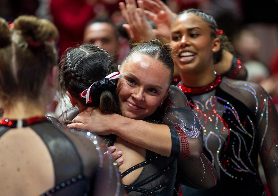 (Rick Egan | The Salt Lake Tribune)  Maile O'Keefe gets hug form a team mate after scoring a 10 on the beam, in gymnastics action between Utah  Red Rocks and Oregon State, at the Jon M. Huntsman Center, on Friday, Feb. 2, 2024.