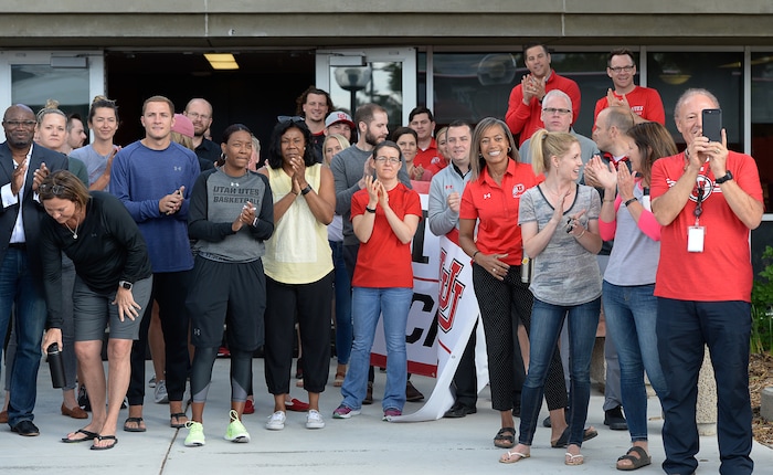 (Francisco Kjolseth  |  The Salt Lake Tribune)  University of Utah staff applaud athletic director Chris Hill at the Huntsman Center on Friday, June 1, 2018, as he says goodbye and climbs aboard a red Ute-branded Holiday Motor coach bus after 31 years on the job.
