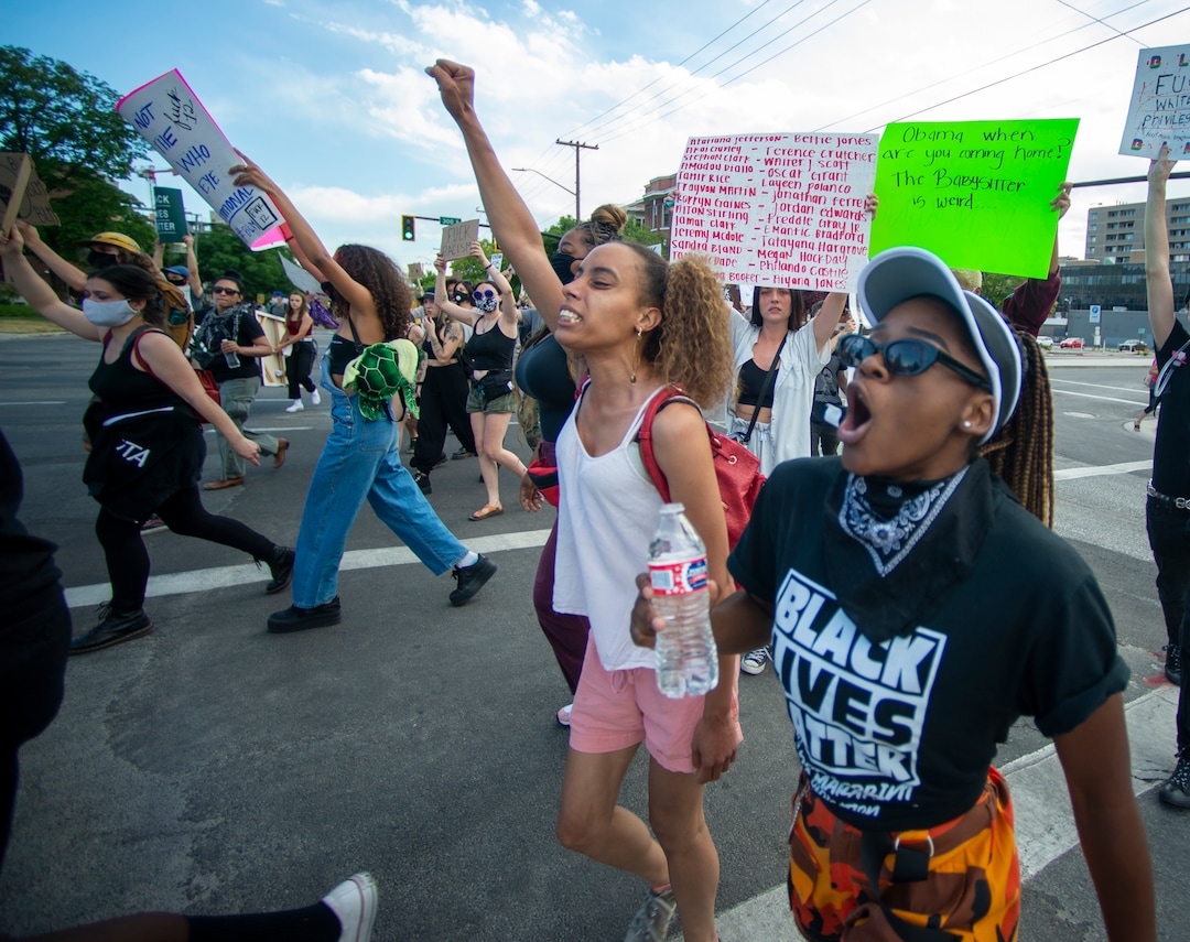 ((Rick Egan  |  The Salt Lake Tribune) Diane Bahati leads the group in a chant as they march to the University of Utah during a George Floyd demonstration on Wednesday, June 3, 2020.
