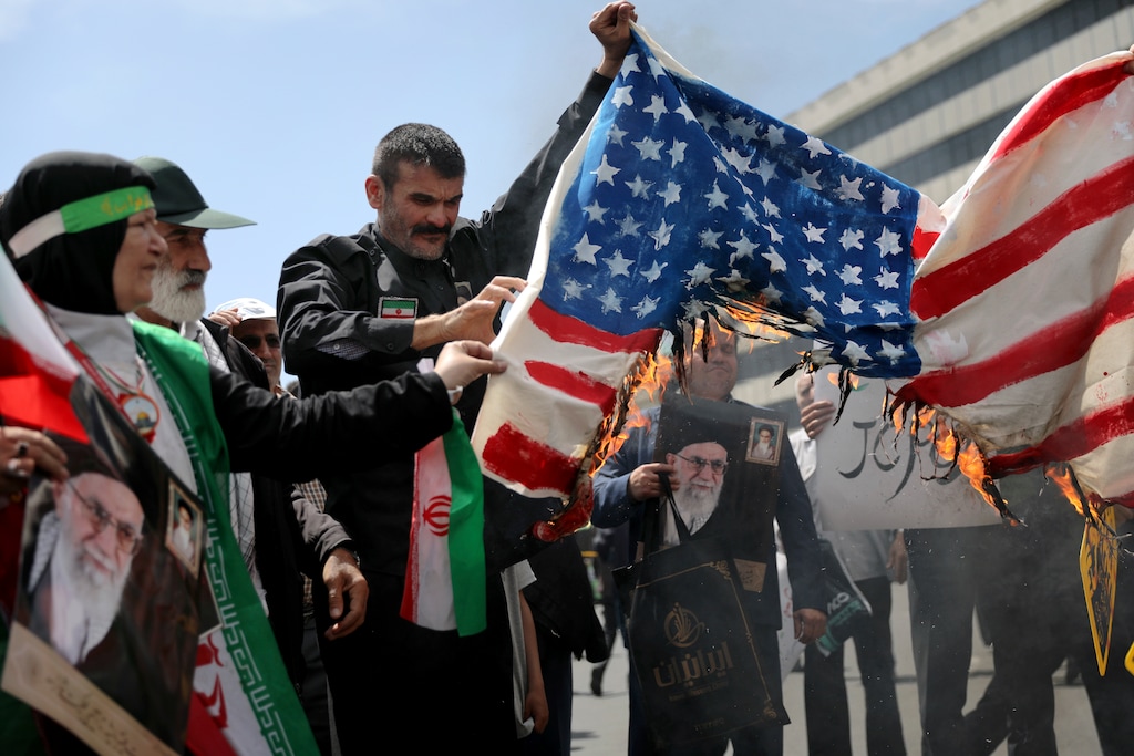 (Ebrahim Noroozi | The Associated Pree) Iranian worshippers burn a representation of a U.S. flag during a rally after Friday prayer in Tehran, Iran, Friday, May 10, 2019. A top commander in Iran's powerful Revolutionary Guard said Friday that Tehran will not talk with the United States, an Iranian news agency reported — a day after President Donald Trump said he'd like Iranian leaders to "call me."
