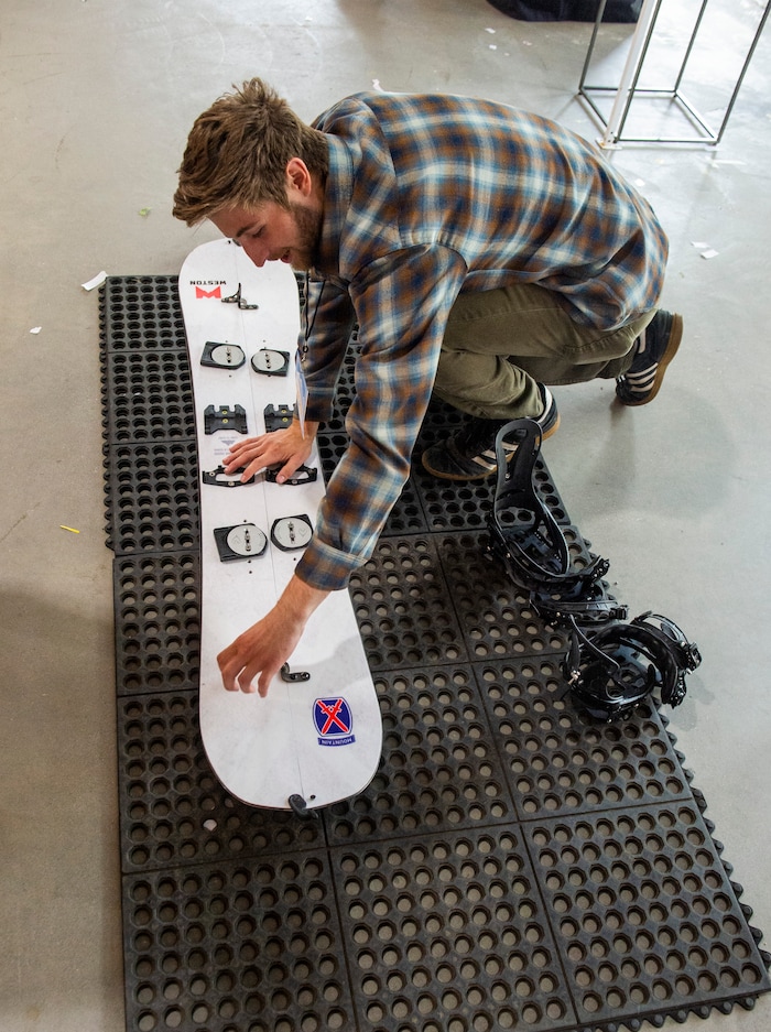(Rick Egan | The Salt Lake Tribune)
Ben Smith puts together a splitboard, which converts two skis in to a snowboard for the back country, at the Weston booth, at the “Rendezvous” Mountain Culture Festival at the Gateway, Saturday, Sept. 28, 2019.