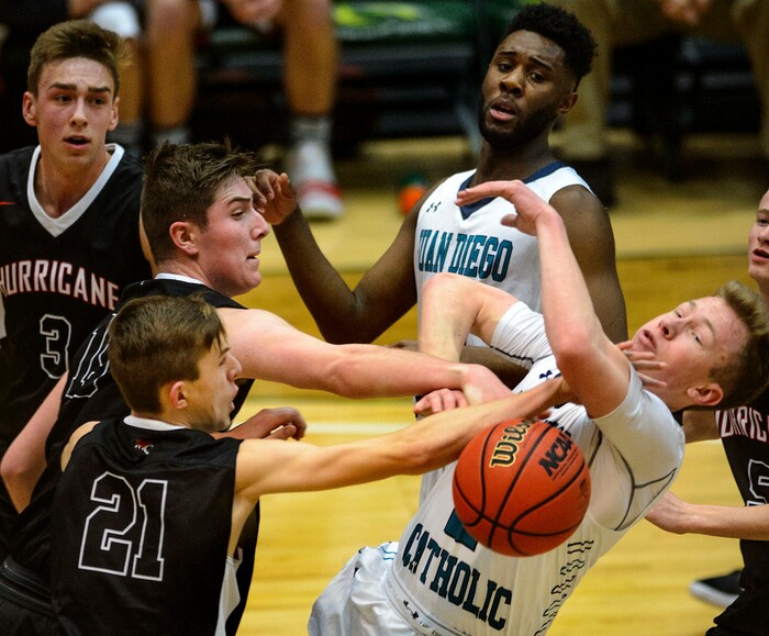 (Steve Griffin | The Salt Lake Tribune) Juan Diego's Matt Kitzman (2) gets the ball stripped away by the Hurricane defense during 4A basketball playoff game at the Utah Valley UniversityÕs UCCU Center in Provo Thursday March 1, 2018.