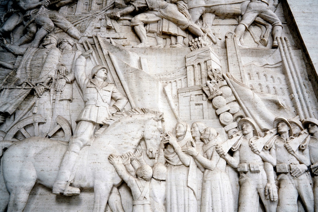 (Andrew Medichini | AP photo)
A detail of a giant marble bas-relief titled "The Story of Rome through its Constructions", made in 1940 by sculptor Publio Morbiducci, shows Italian dictator Benito Mussolini on horseback, at the entrance of a building in the EUR neighborhood of Rome, Monday, May 6, 2019. Mussolini transformed Rome’s urban landscape with grand construction projects like EUR, a new city district that was originally designed as celebration of fascism for a world fair in 1942. The fair was canceled due to World War II and construction was halted but resumed after the war.