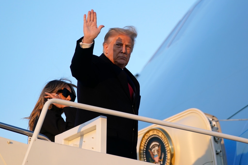 (Patrick Semansky | AP photo)

President Donald Trump waves as he boards Air Force One at Andrews Air Force Base, Md., Dec. 23.