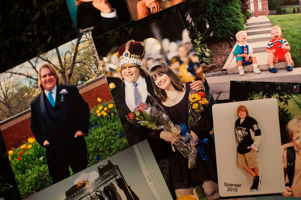 (Stephanie Strasburg | Pittsburgh Post-Gazette | The Associated Press) In this Thursday, March 22, 2018 file photo, a photo of Spenser Flowers as homecoming king at Hampton Township High School in 2014 is surrounded by other photos from his life in a collage at his parents' home in Hampton Township, Pa. After Flowers' died of an opioid overdose in January of 2017, Hampton schools launched a drug prevention crusade and his mother, Tina Flowers, launched the non-profit Spencer's Voice to combat drug abuse in young people.