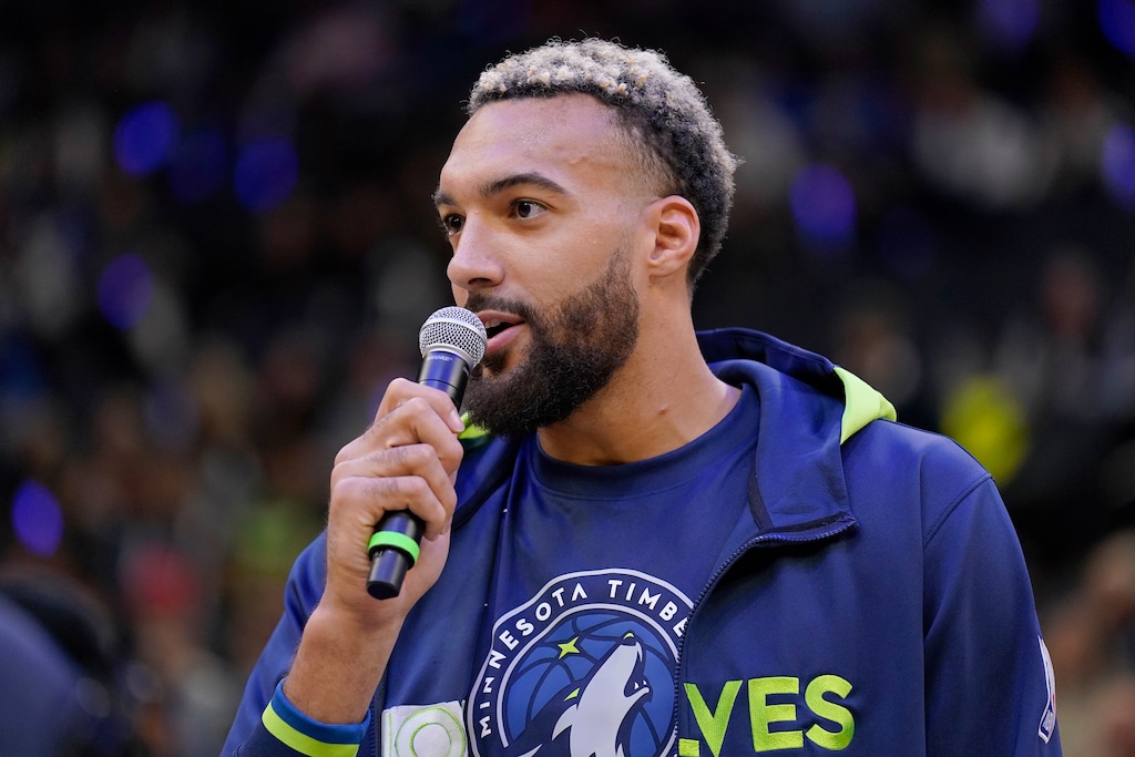 (Abbie Parr | The Associated Press) Minnesota Timberwolves center Rudy Gobert speaks to the crowd before the team's opening game against the Oklahoma City Thunder on Wednesday, Oct. 19, 2022. On Friday, Oct. 21, Gobert faces the Utah Jazz, his team of nine years, for the first time.
