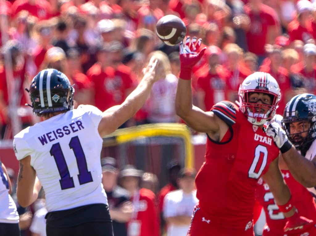 (Rick Egan | The Salt Lake Tribune)  Utah Utes defensive end Logan Fano (0) gets a piece of a pass thrown by Weber State Wildcats quarterback Kylan Weisser (11) on Sept. 16, 2023. Fano will miss the rest of the year with a torn ACL.
