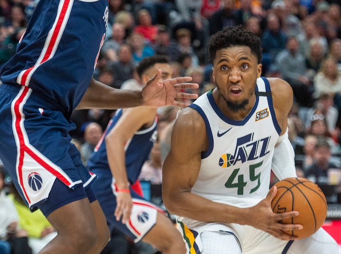 (Rick Egan  |  The Salt Lake Tribune) Utah Jazz guard Donovan Mitchell (45) looks for a shot, as Washington Wizards center Thomas Bryant (13) defends, in NBA action between the Utah Jazz and the Washington Wizards, in Salt Lake City, Friday, February 28, 2020