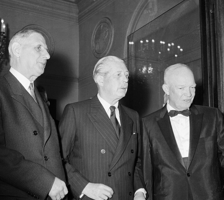 FILE - In this Tuesday, May 17, 1960 file photo, President Charles de Gaulle of France, left, Premier Harold MacMillan of  Britain, center, and U.S. President Dwight D. Eisenhower leave a summit at the Elysee Palace in Paris. De Gaulle would veto Britain's application to join the then European Economic Community on two occasions that decade. Britain on Wednesday March 29, 2017  triggered the mechanism to  leave the European Union.  (AP Photo, File)