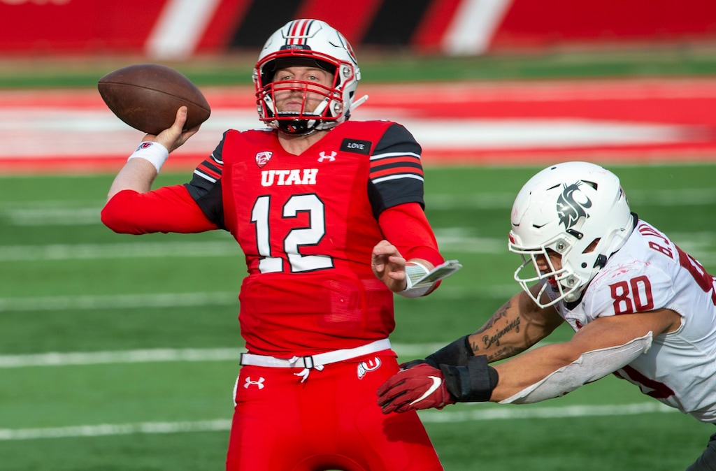 (Rick Egan | The Salt Lake Tribune) Utah Utes quarterback Drew Lisk (12) throws a pass as Washington State Cougars defensive end Brennan Jackson (80) defends, in PAC-12 football acton between Utah Utes and Washington State Cougars at Rice-Eccles Stadium on Saturday, Dec. 19, 2020.