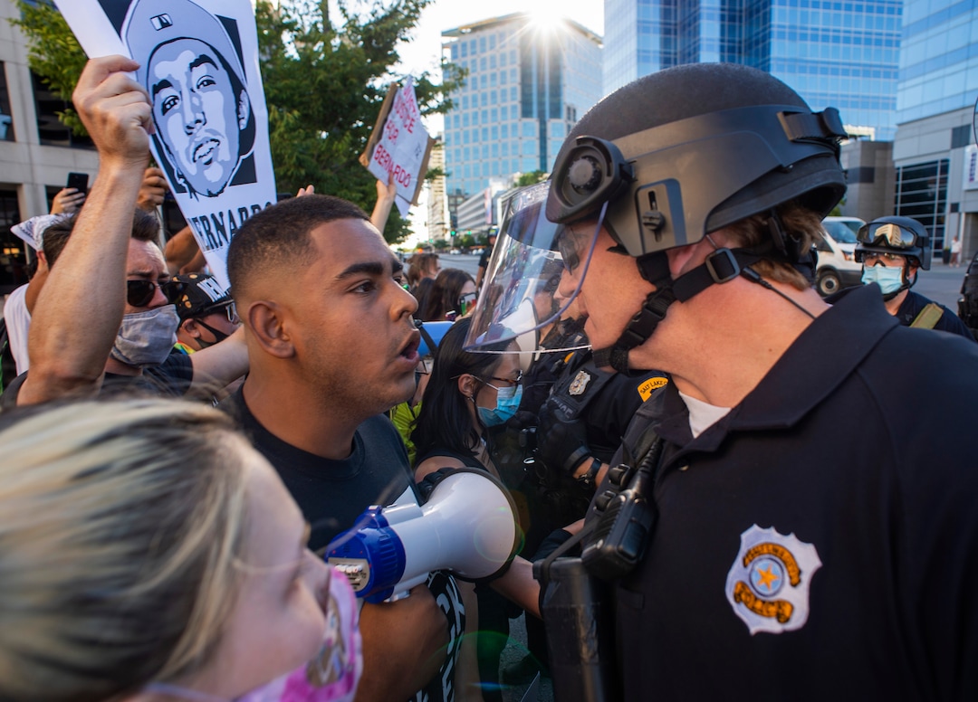 (Rick Egan  |  The Salt Lake Tribune) Emanuel Hill faces off with the Salt Lake City Police during a Justice for Bernardo Palacios-Carbajal protest in Salt Lake City on Tuesday, June 23, 2020.