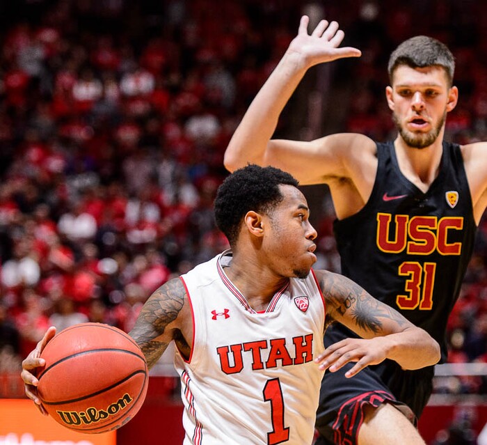(Trent Nelson | The Salt Lake Tribune)  Utah Utes guard Justin Bibbins (1), USC Trojans forward Nick Rakocevic (31), as the University of Utah hosts USC, NCAA basketball at the Huntsman Center in Salt Lake City, Saturday Feb. 24, 2018.