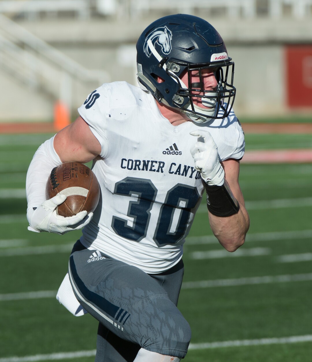 (Rick Egan  |  The Salt Lake Tribune)    Corner Canyon defense back Caden Johnson (30) runs with the ball for the Chargers after an interception, in 5A football semifinal action between Olympus and Corner Canyon at Rice-Eccles Stadium, Thursday, Nov. 8, 2018.