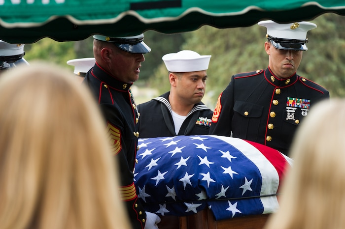 (Alex Gallivan  |  Special to The Tribune) Marine Pfc. Robert K. Holmes, who died 77 years ago aboard the USS Oklahoma during the attack on Pearl Harbor, is laid to rest in the Salt Lake City Cemetery, Monday, Aug. 20, 2018.
