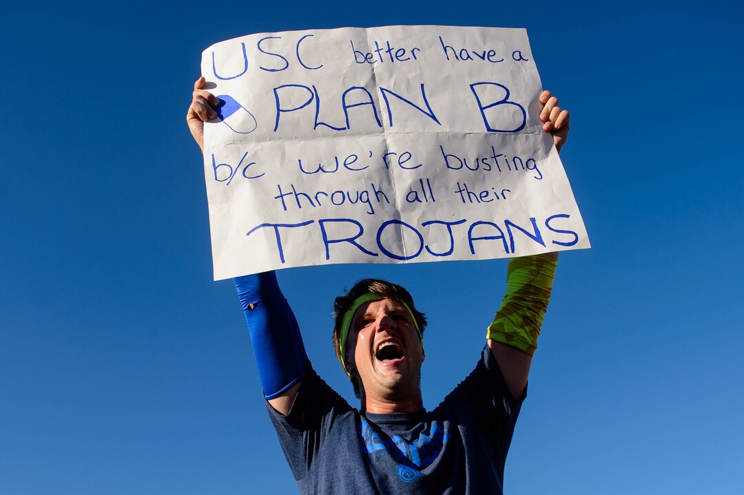 (Trent Nelson  |  The Salt Lake Tribune)  BYU fans rush the field to celebrate the overtime win as BYU hosts USC, NCAA football in Provo on Saturday Sept. 14, 2019.