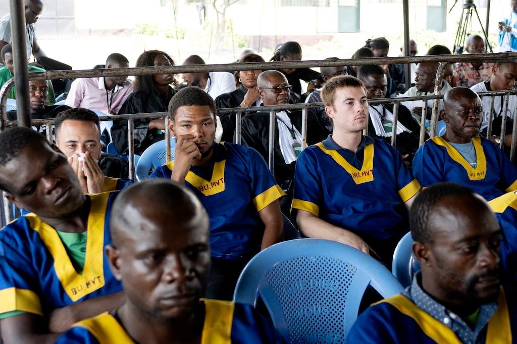 (Samy Ntumba Shambuyi | AP) Back row, Tyler Thompson, 2nd left, Marcel Malanga, center, and Benjamin Reuben Zalman-Polun, 2nd right, all American citizens, attend a court verdict in Congo, Kinshasa, Friday Sept .13, 2024, on charges of taking part in a coup attempt in May 2024.