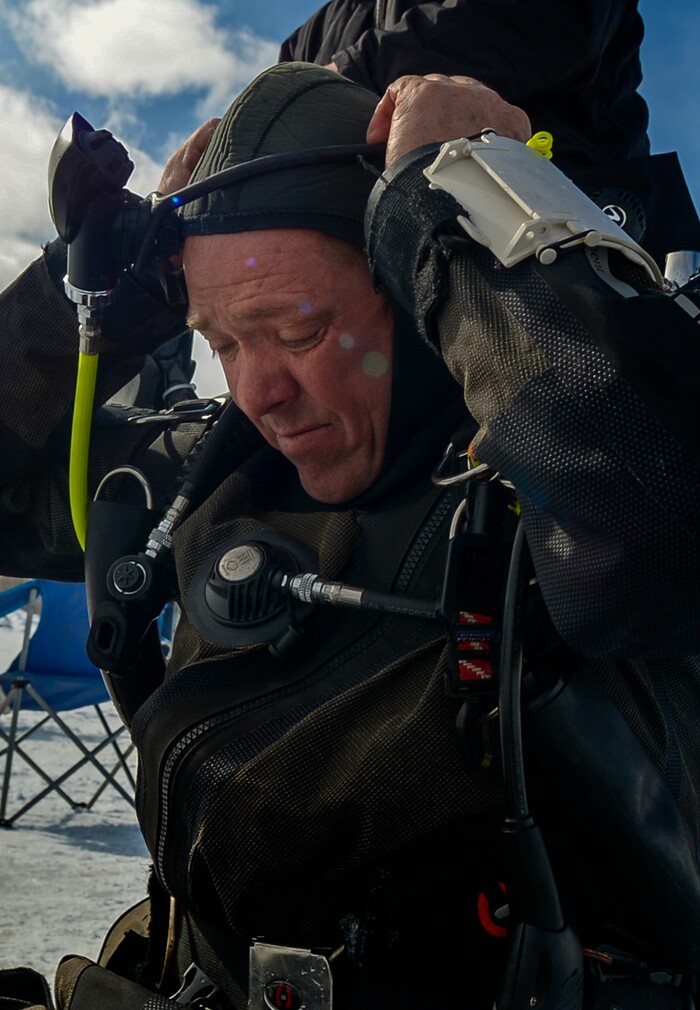 Leah Hogsten | The Salt Lake Tribune Utah Department of Public Safety's Dive Team member Jeff Arbon prepares to enter the water. The Utah Department of Public Safety's Dive Team and the Riverside County Sheriff's Office joined forces for a day of ice diving at Deer Creek Reservoir, Feb. 20, 2019. Twenty members from Riverside County Sheriff's Department dove in icy waters alongside DPS' 10 man team in a joint team training day, Wednesday. Members of the Riverside County Sheriff's were working to become certified in ice diving under the team's lieutenant and dive master. Due to the equipment assets and the unique diver skill sets, dive teams are often called upon to provide assistance to aquatic homicide investigations and accidental drownings.