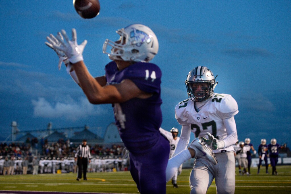 (Scott Sommerdorf   |  The Salt Lake Tribune)   
Olympus DB Jaxson Allred is helpless to stop this TD catch by Lehi's Jaxon Moody during the first half Friday.
