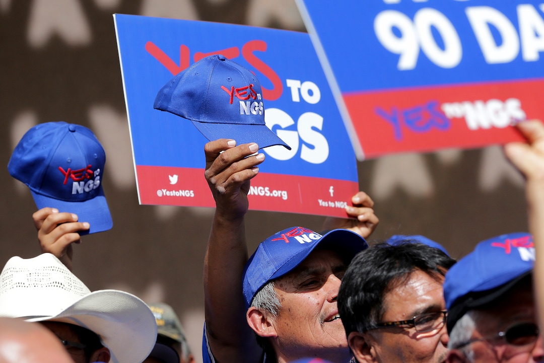 People rally outside the Capitol in Phoenix, Wednesday, June 6, 2018. Hundreds of Navajo Generating Station employees, relatives and union and tribal leaders rallied at the state Capitol in Phoenix on Wednesday to request a 90-day pause in steps to close the coal-fueled plant by the end of 2019 as scheduled. (AP Photo/Matt York)