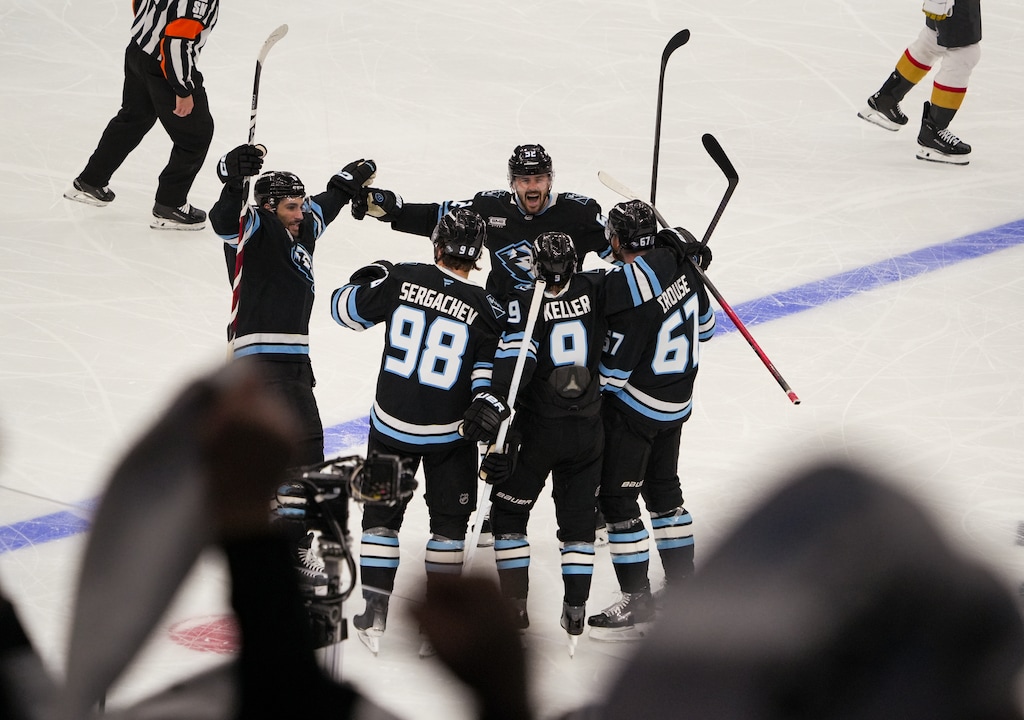(Chris Samuels | The Salt Lake Tribune) Utah Mammoth teammates celebrate after left wing Lawson Crouse (67) scores a goal during Game 3 of the first round of the Stanley Cup playoffs against the Vegas Golden Knights.