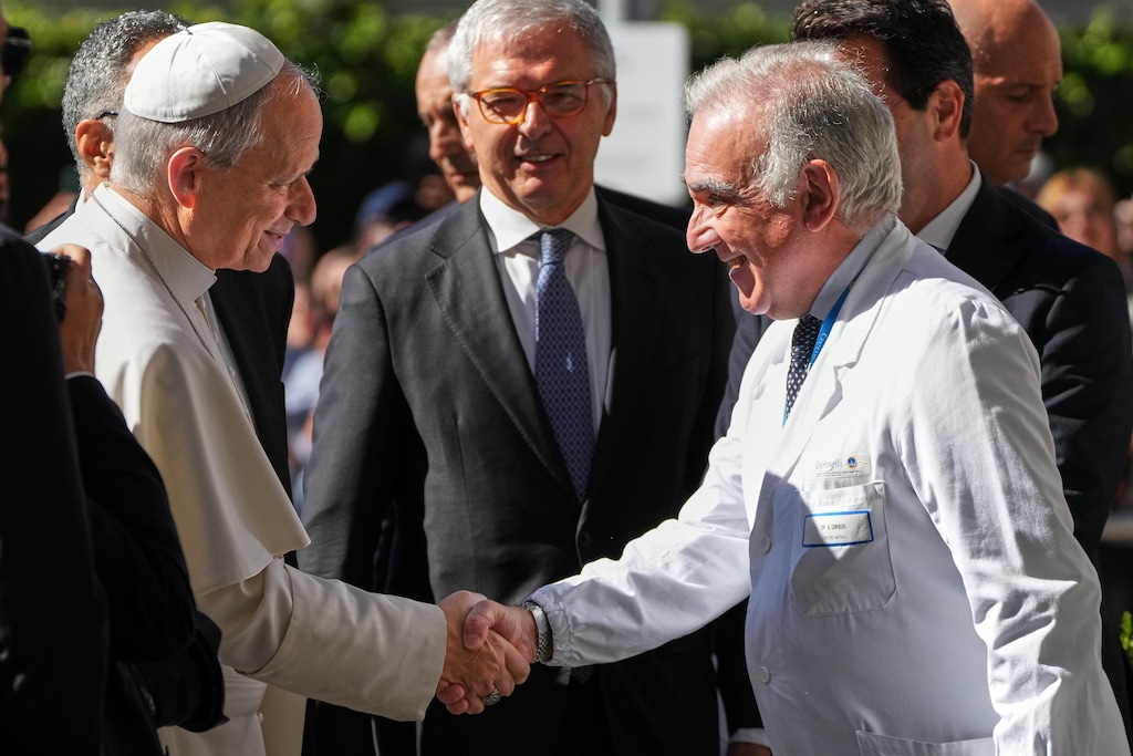 (Gregorio Borgia | AP)Medical Director Andrea Cambieri, right, greets Pope Leo XIV as he arrives at the Agostino Gemelli Polyclinic in Rome on Tuesday, Oct. 13, 2026, where doctors removed a cancerous lung nodule.