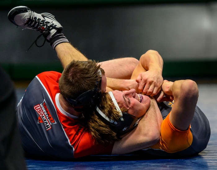 (Steve Griffin  |  The Salt Lake Tribune) Brock Hardy, of Box Elder, left, locks down on Brad Lowery, of Canyon View, during the All-Star Duals wrestling at Utah Valley University's UCCU Center in Orem Tuesday January 9, 2018.