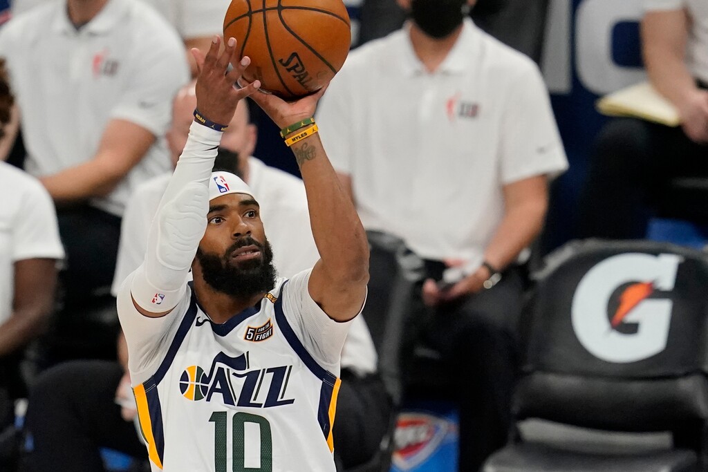 Utah Jazz guard Mike Conley (10) shoots over Oklahoma City Thunder center Moses Brown (9) in the first half of an NBA basketball game Friday, May 14, 2021, in Oklahoma City. (AP Photo/Sue Ogrocki)
