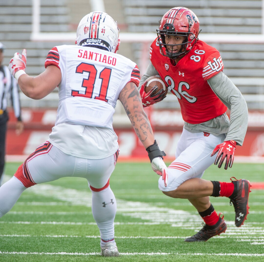 (Rick Egan  |  The Salt Lake Tribune) Wide Receiver Devaught Vele runs the ball, as Keala Santiago defends, in Utah's spring Red-White game at Rice-Eccles Stadium, Saturday, April 13, 2019.