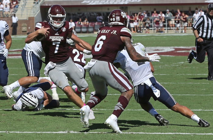 Mississippi State quarterback Nick Fitzgerald (7) receives a block from wide receiver Donald Gray (6) allowing him to score a touchdown during the first half of an NCAA college football game against BYU in Starkville, Miss., Saturday, Oct. 14, 2017. (AP Photo/Jim Lytle)