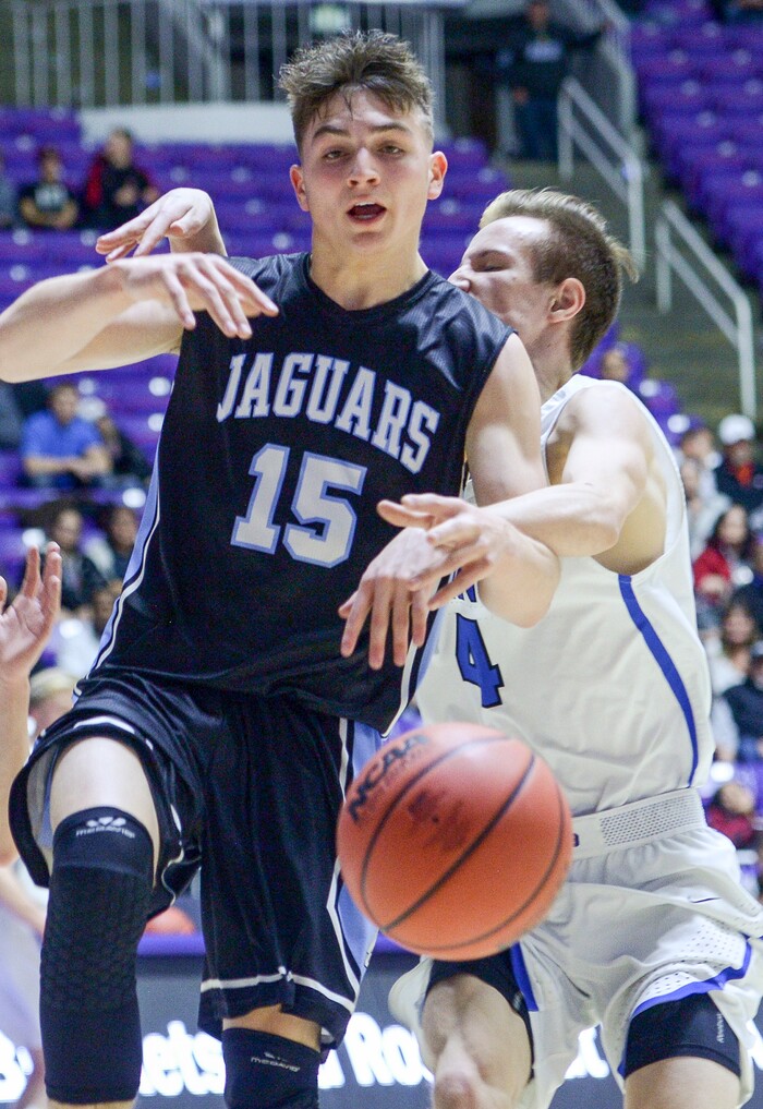 (Leah Hogsten  |  The Salt Lake Tribune) West Jordan's Christian Rhodes-Jimenez (15) is fouled by Pleasant Grove's Jake Pincock (04). Pleasant Grove defeated West Jordan 62-54 in the 6A High School Boys' Basketball Tournament opening game at Weber State University’s Dee Events Center in Ogden,  Tuesday, Feb. 27, 2018. 