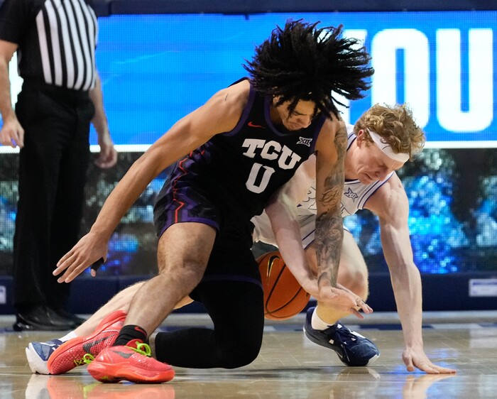 (Francisco Kjolseth | The Salt Lake Tribune) TCU Horned Frogs guard Micah Peavy (0) battles Brigham Young Cougars guard Richie Saunders (15) for a loose ball during an NCAA college basketball game against TCU Saturday, March 2, 2024, in Provo, Utah.
