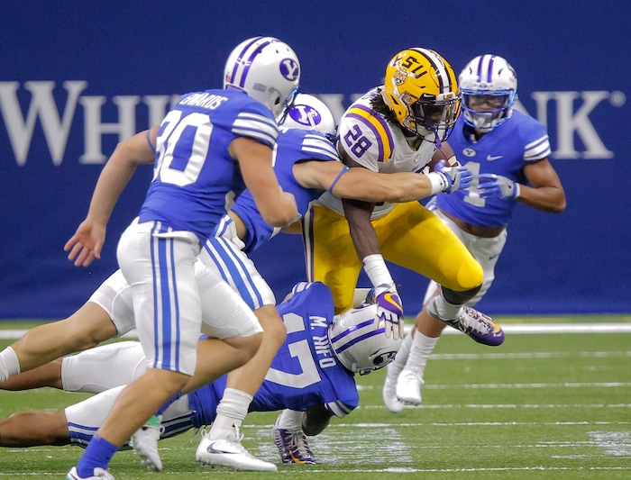LSU running back Darrel Williams (28) runs against BYU in the first half of an NCAA college football game in New Orleans, Saturday, Sept. 2, 2017. (AP Photo/Scott Threlkeld)