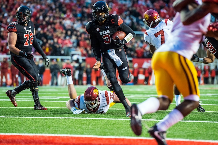 Chris Detrick  |  The Salt Lake Tribune
Utah Utes quarterback Troy Williams (3) scores a touchdown past USC Trojans linebacker Cameron Smith (35) and USC Trojans defensive back Marvell Tell III (7) during the first half of the game at Rice-Eccles Stadium Friday September 23, 2016. 