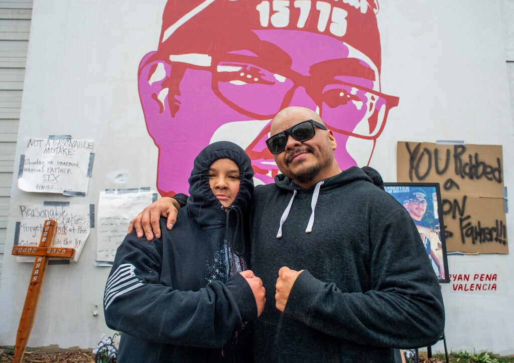 (Rick Egan | The Salt Lake Tribune) Luciano Pena-Valencia, Bryan Pena-Valencia's son, poses with Mario Herrera at the memorial for Bryan Pena-Valencia on Saturday, March 20, 2021. Bryan Pena-Valencia was killed in March 2020 by Unified police officer Omar Flores. He was unarmed. Herrera filed a lawsuit on behalf of Bryan Pena-Valencia on Wednesday, May 5, 2021, alleging
 Flores unnecessarily used deadly force.