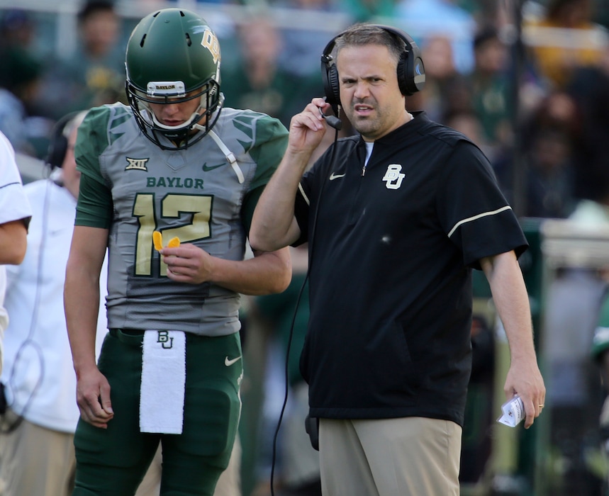 (Rod Aydelotte | Waco Tribune-Herald via AP) Baylor head football coach Matt Rhule, right, looks on with quarterback Charlie Brewer during their matchup with Iowa State in the second half of an NCAA college football game, Saturday, Nov. 18, 2017, in Waco, Texas.