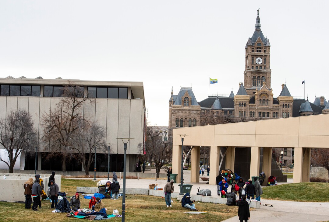 (Rick Egan | The Salt Lake Tribune) People are forced to pack up their belongings in carts and wagons near the Salt Lake City Library, Monday, Dec. 23, 2019.