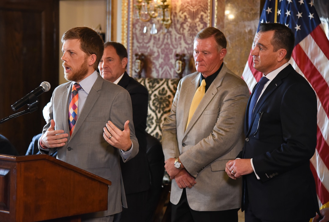 (Francisco Kjolseth  |  The Salt Lake Tribune)  Libertas Institute president Connor Boyack answers questions from the media alongside Gov. Gary Herbert, Sen. Evan Vickers, R-Cedar City, and House Speaker Greg Hughes, from left, following an announcement of a compromise to the medical marijuana bill.  Supporters and opponents of UtahÕs medical marijuana initiative joined with Utah Gov. Gary Herbert and legislative leaders Thursday, Oct. 4, 2018, at the Utah Capitol to announce a Òshared visionÓ for cannabis policy.