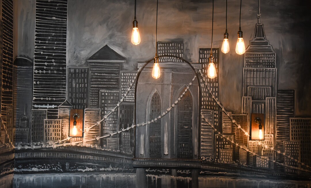 (Francisco Kjolseth  |  The Salt Lake Tribune)  New York skyline murals at Wicked Peel Pizza Kitchen in Riverton.