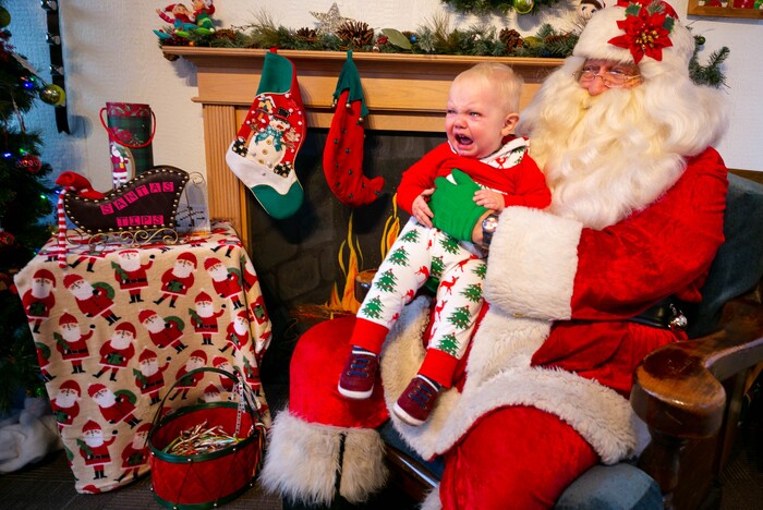 (Trent Nelson | The Salt Lake Tribune) Teddy Weathers, 15 months old, has his first visit with Santa at the Sugar House Santa Shack in Salt Lake City on Friday, Dec. 20, 2019.