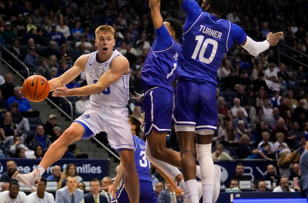 (Bethany Baker | The Salt Lake Tribune) Brigham Young Cougars guard Dallin Hall (30) passes the ball as he is defended by Georgia State Panthers guard Dwon Odom (1) and forward Jay'Den Turner (10) as BYU hosts Georgia State in NCAA basketball in Provo on Saturday, Dec. 16, 2023.