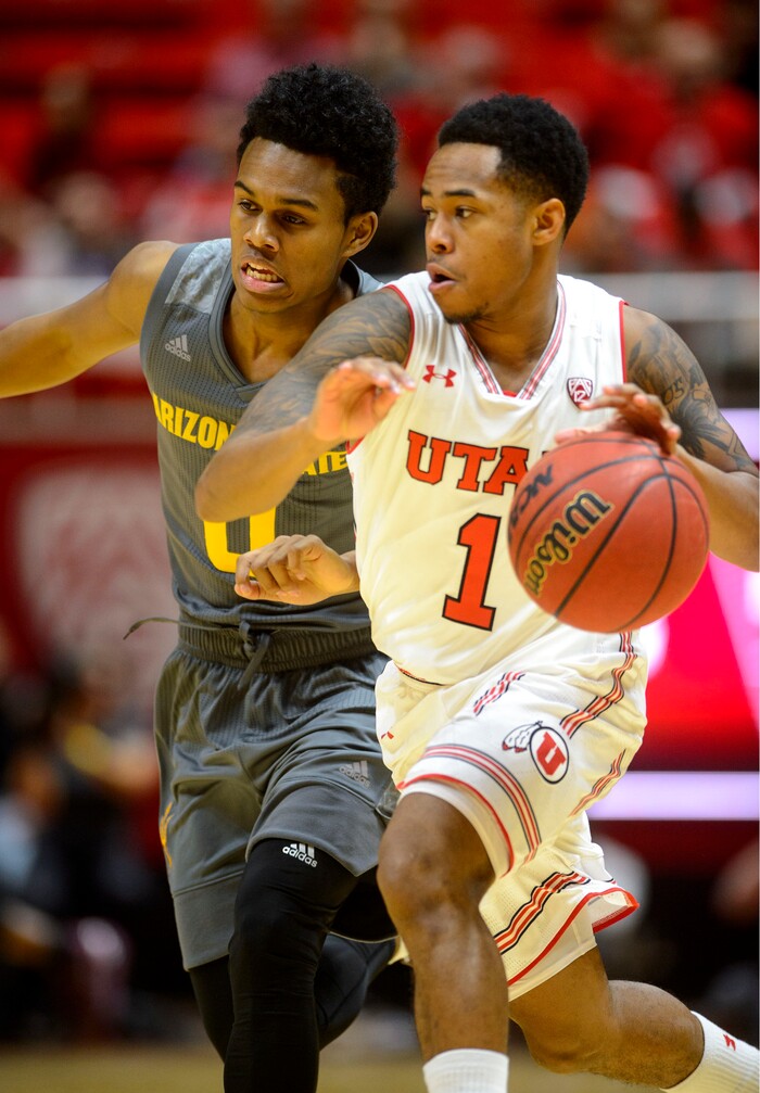 (Steve Griffin  |  The Salt Lake Tribune) Utah Utes guard Justin Bibbins (1) drives past Arizona State Sun Devils guard Tra Holder (0) during the Utah Utes versus Arizona State Sun Devils at the Huntsman Center on the University of Utah campus in Salt Lake City Sunday January 7, 2018.