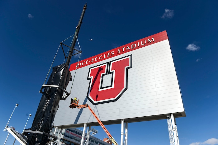 (Leah Hogsten | The Salt Lake Tribune) Workers with Layton Construction and Mountain Crane began dismantling the 2002 Winter Olympic Cauldron located on the University of Utah's Rice-Eccles Stadium complex, Thursday, Feb. 13, 2020. As part of the stadium's expansion project, the 19-year old cauldron will be restored to its former brilliance and re-installed on the grounds of Rice-Eccles Stadium, north of the ticket office, in 2021.